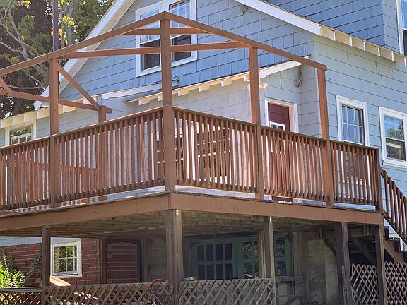 Huge back deck with access via external stairs or second, back door to apartment.