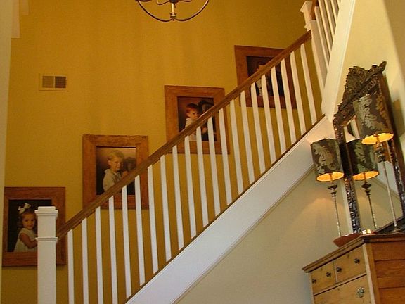 Grand two-story entry hall with hardwood stair case