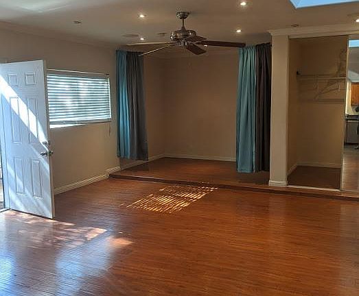 Front door, bedroom nook and walk in closet from entertainment area