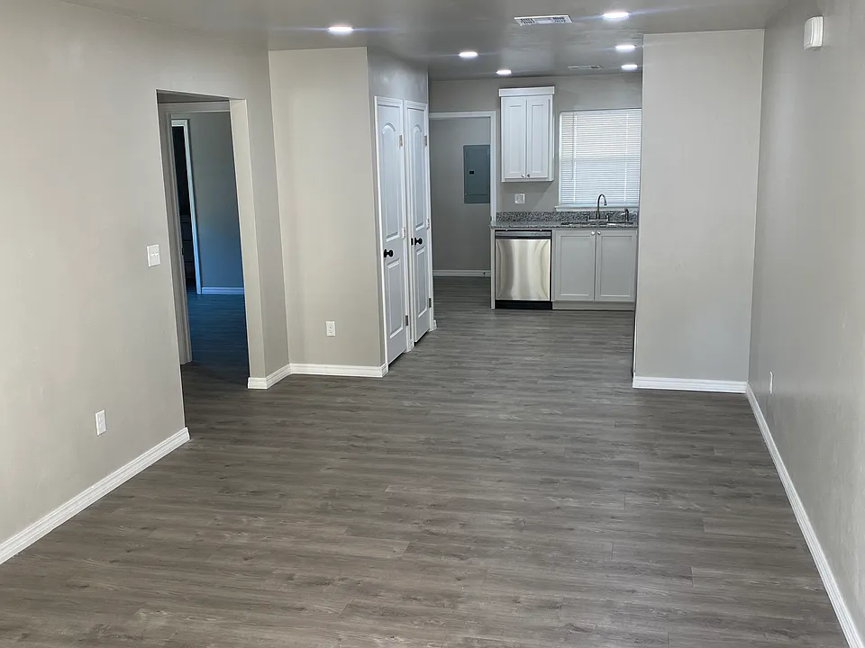 Spacious living room, open concept connecting the kitchen.