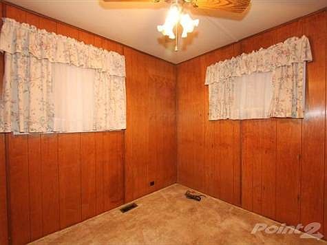 A bedroom at each end of this adorable little home.