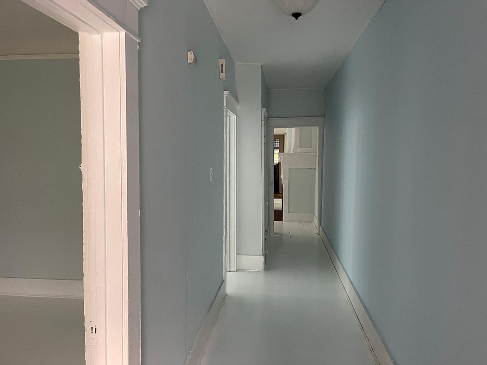 Front door down hallway with bedroom 1 on left