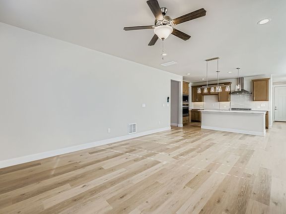 Plan C305 Representative Photo of the Living Room Dining Area Kitchen