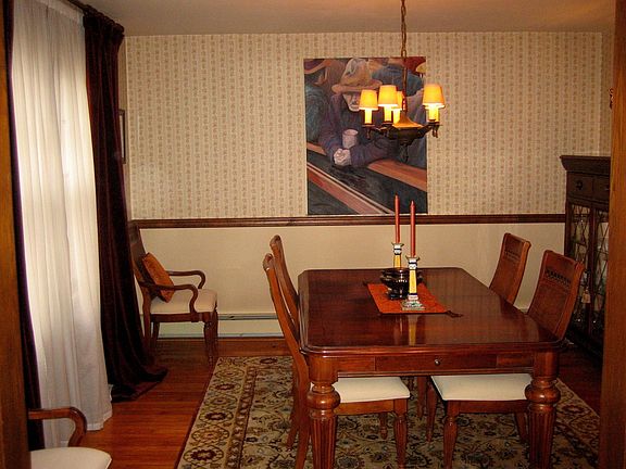 Elegant dining room with original chestnut molding.