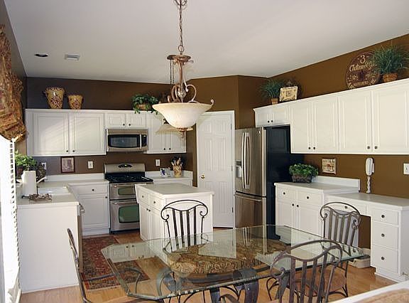 Kitchen-open view to family room. SS appliances (double oven/french door refr)