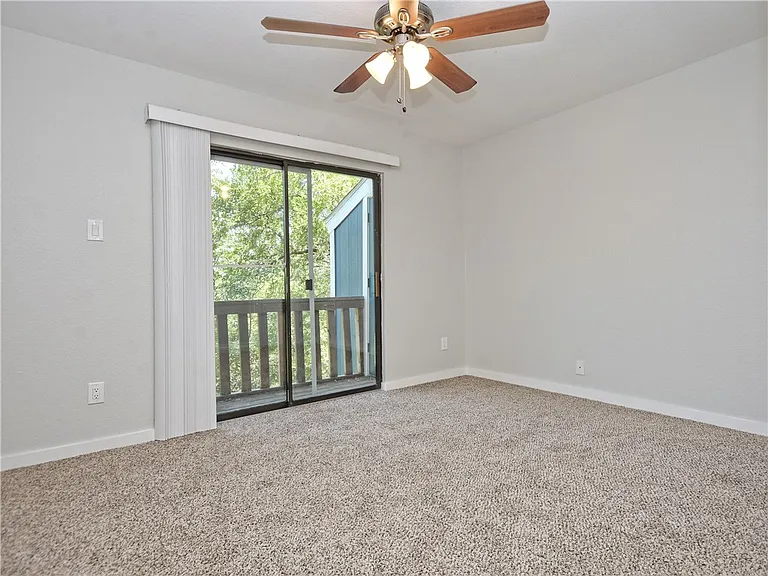 Bedroom 2 with connecting balcony overlooking Greenbelt!