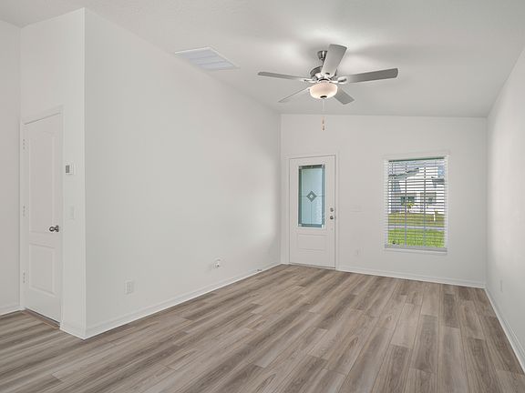 The entryway is highlighted by this gorgeous 3 4 lite door!