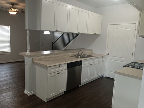 Kitchen. There is a pantry. The door in the view is where the washer/dryer hookups are.