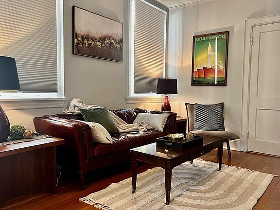 Stylish and comfortable living room with large winows.