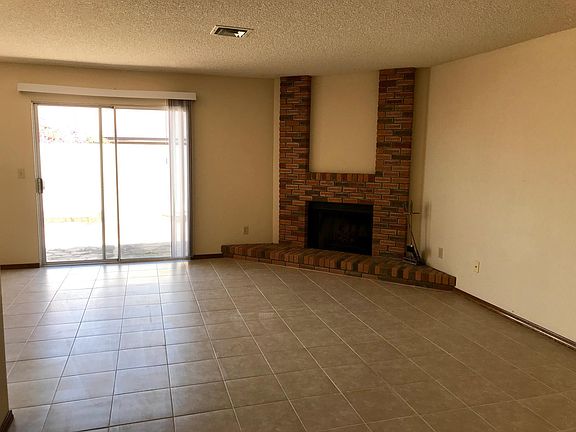 Living room with wood burning fireplace
