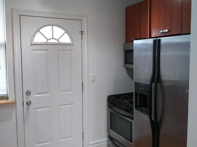 Kitchen with entrance from the backstairs / deck
