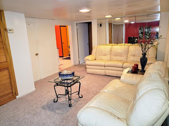 Featuring white leather couch with 4 pull out recliners