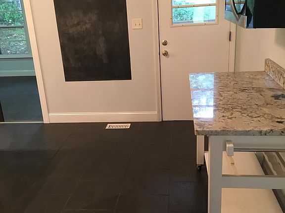 Kitchen, microwave and backdoor view