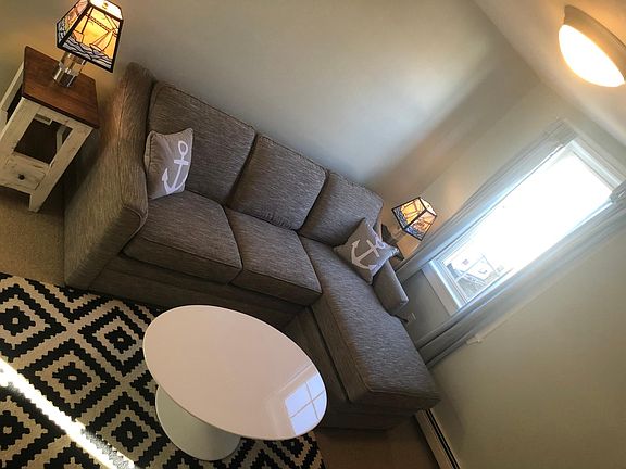 Living room with new chaise couch, oval table