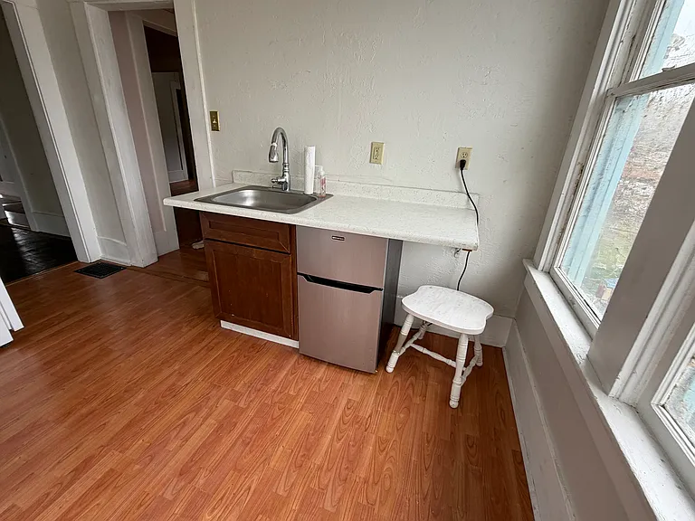Kitchen with extra under cabinet fridge