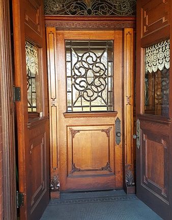 Inside front door : This door is surrounded by stained glass and opens into the center hallway