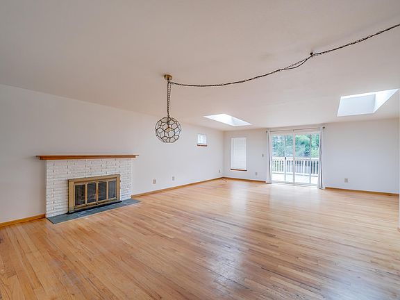 Living room opens to the expansive back deck