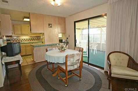 Cute kitchen and dining area opens up to patio
