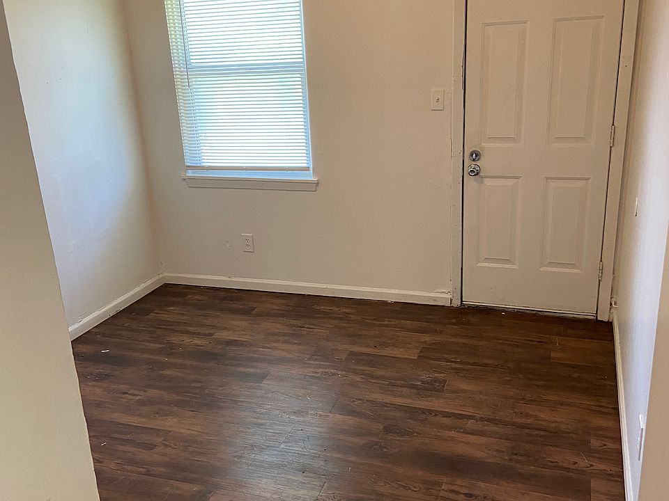 Door to back yard in one bedroom