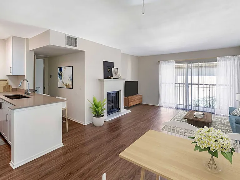 Renovated Package I kitchen, dining, and living area with hard surface flooring