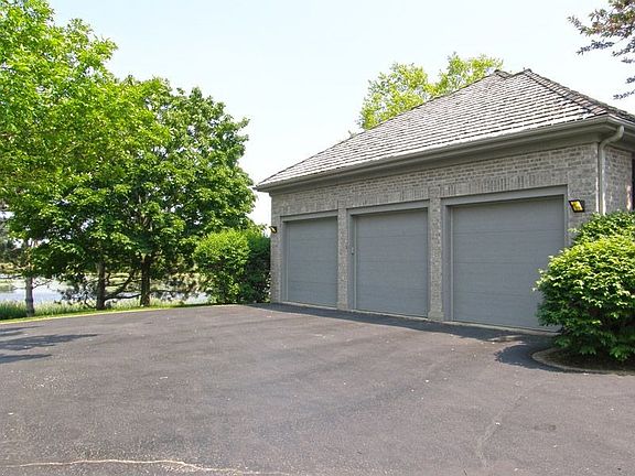 Huge Drive Way Leading to 3 Car Garage