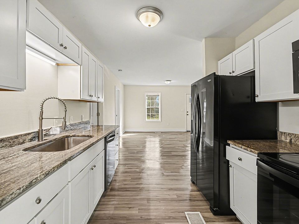 Kitchen with stove/oven, refrigerator, microwave, and dishwasher