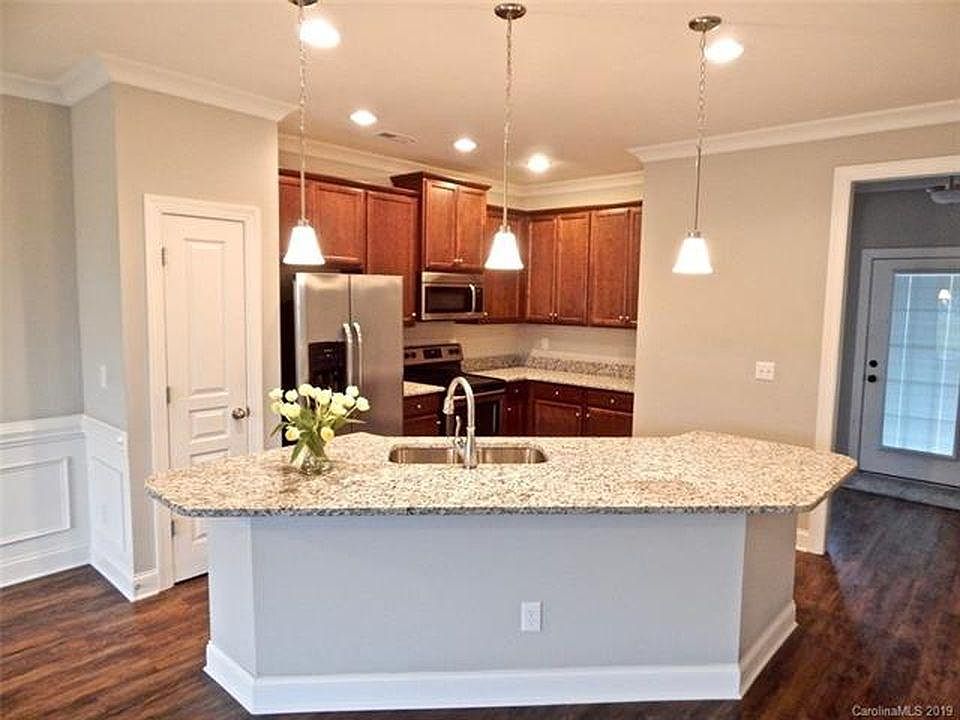 Kitchen - stainless steel appliances, large eat-in island, plenty of storage cabinets and pantry
