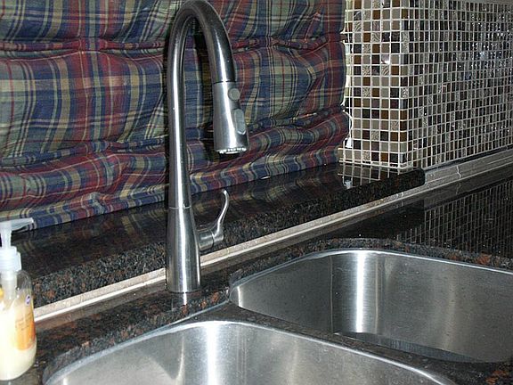 stainless sink with granite surround