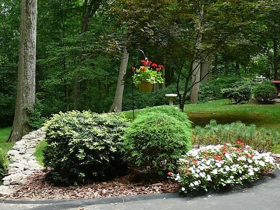 Landscaped with inground sprinkler system in front yard.