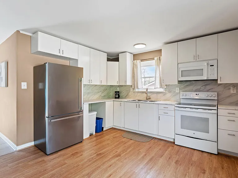 Kitchen equipped with new kitchen essential appliances.
