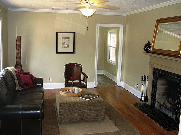 Big bright living room with working fireplace and ceiling fa. Living opens to dining and office/bonu