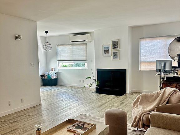 Large living room. can see it is adjacent to dining area
