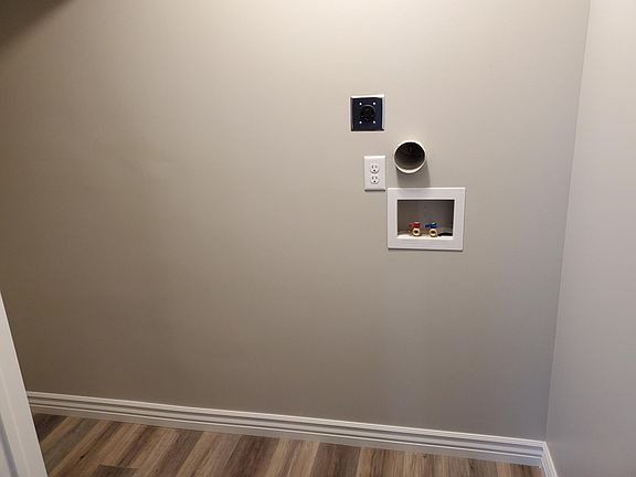 Laundry hookups with some storage