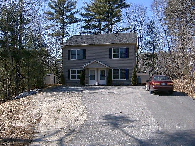 Quiet 2-unit townhouse style apartment, set back from road; large parking area