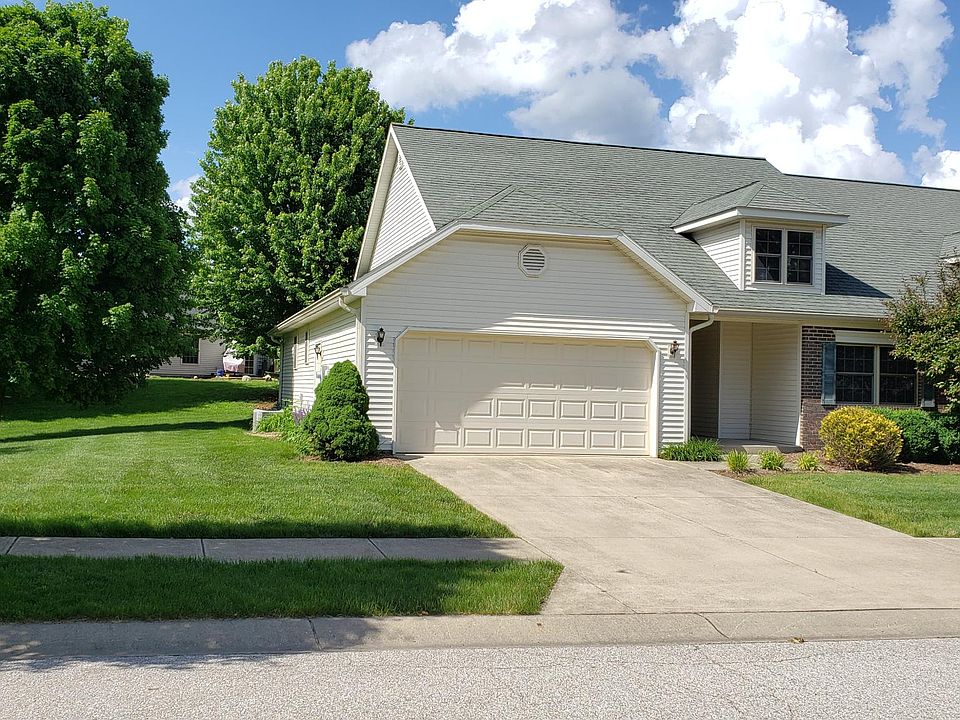 Front entrance, 2 car garage, green space in adjacent lot.