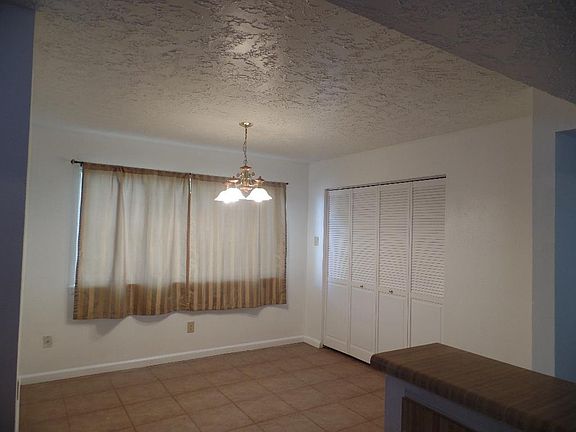 Large dining room ((10.5' x 11.5') has enough area to set a large dining table. The shutter door hide the laundry room from plain view.