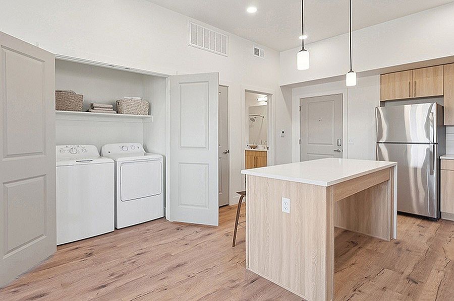 Kitchen and Laundry Room at Current Apartments