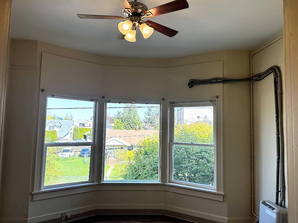 Lots of natural light through the bay windows. Could be the living room or bedroom; your choice!