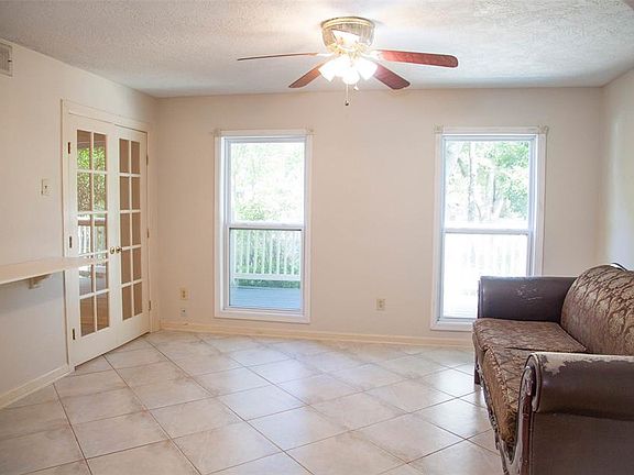 Formal Living room as walk in the front door to the left, also windows to front yard