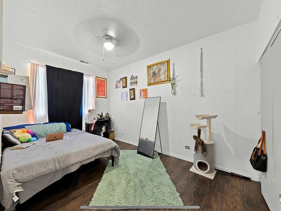 The largest bedroom, boasting room for a king bed, a larger closet, ceiling fans, and an east-facing window looking over your unit''s private patio.