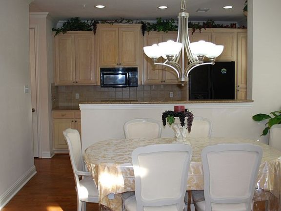 Upgraded kitchen - granite counters, breakfast bar. Overlooking open Dining.