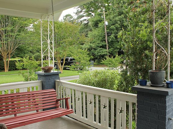 Covered front porch with swing, great for morning coffee and