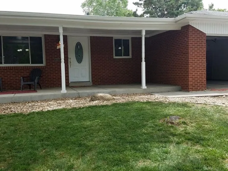 covered front porch, two car garage