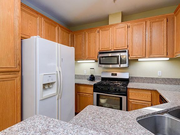 Nice granite countertop with plenty of cabinet space.