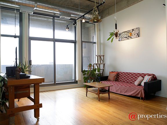 Living room, adjacent patio overlooking river