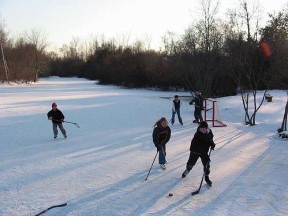 pond as ice rink in winter