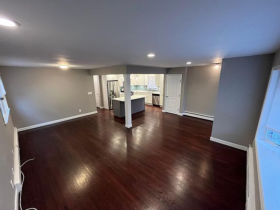 Modern open concept. Large living room, dining room, kitchen with island.