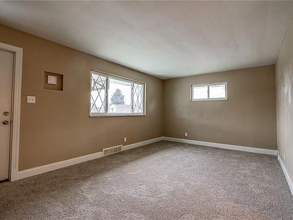 Large window in the living room area allows for the light to pour in.
