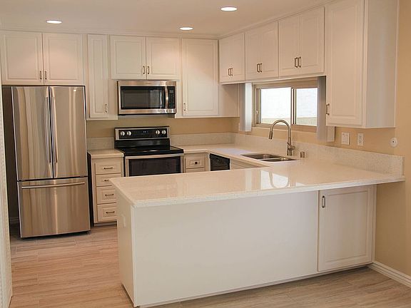 Kitchen with Quartz counters and stainless appliances
