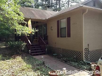 Front of house
						:
						The house sits on 2 wooded lots.